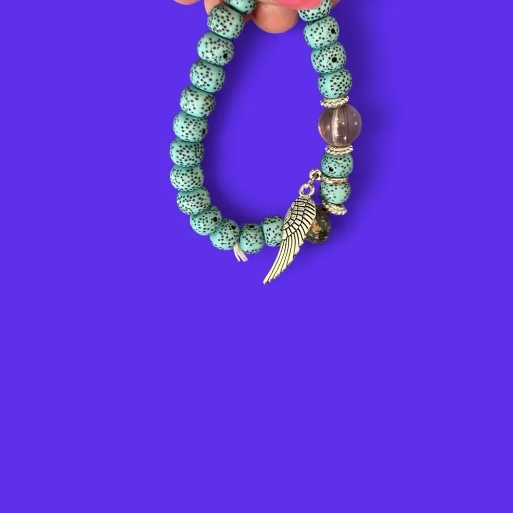 Greenish and silver boho beaded bracelet with Charms